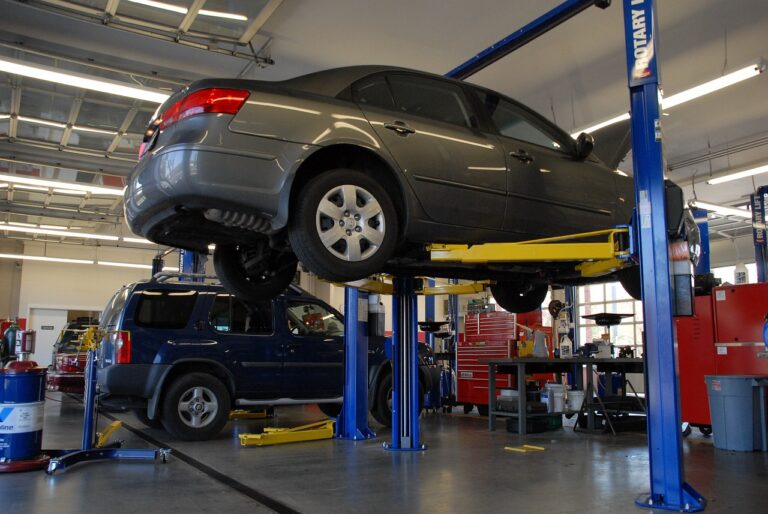 car raised on a hoist for roadworthy inspection